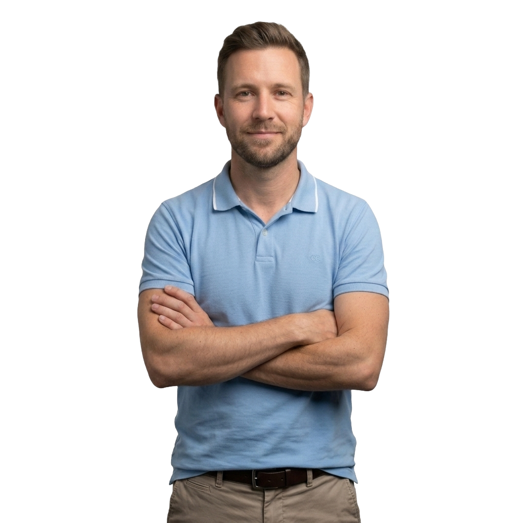 A CPG operations lead, arms crossed, standing confidently